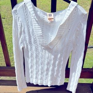 White cable knit sweater with hood.